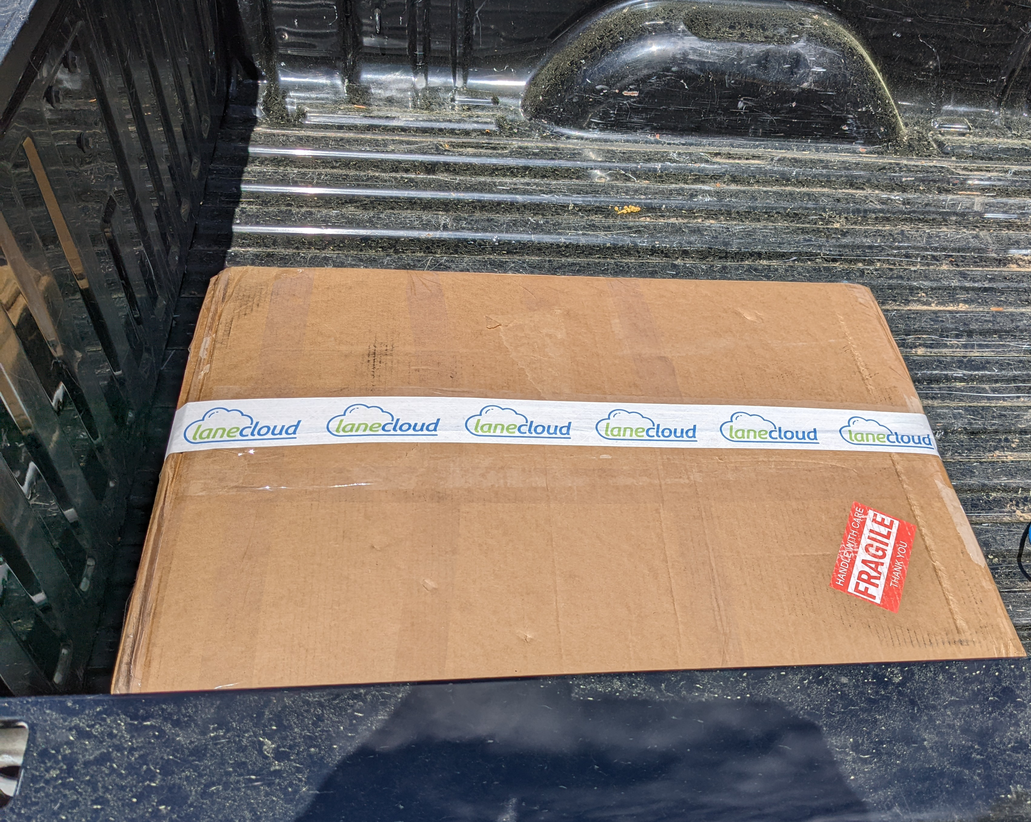 large box in truck bed sealed with lanecloud branded tape